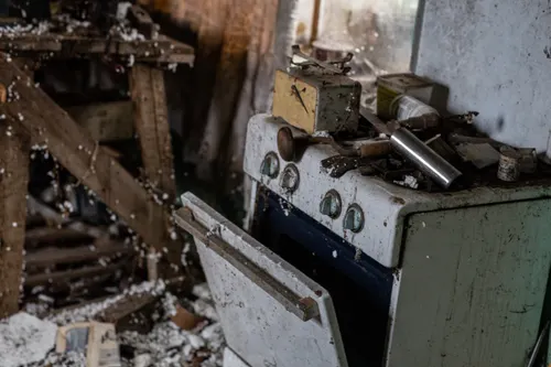 Kitchen demolition work in a Tacoma remodel with cabinets torn out