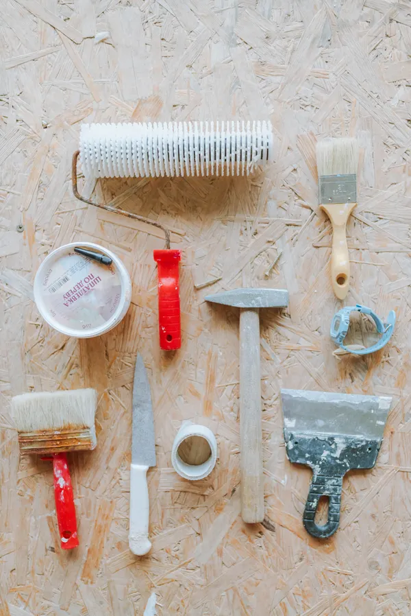 Worker with tools on a Tacoma kitchen remodel in progress